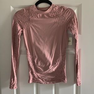 Free People top with sleeve details. NWT.